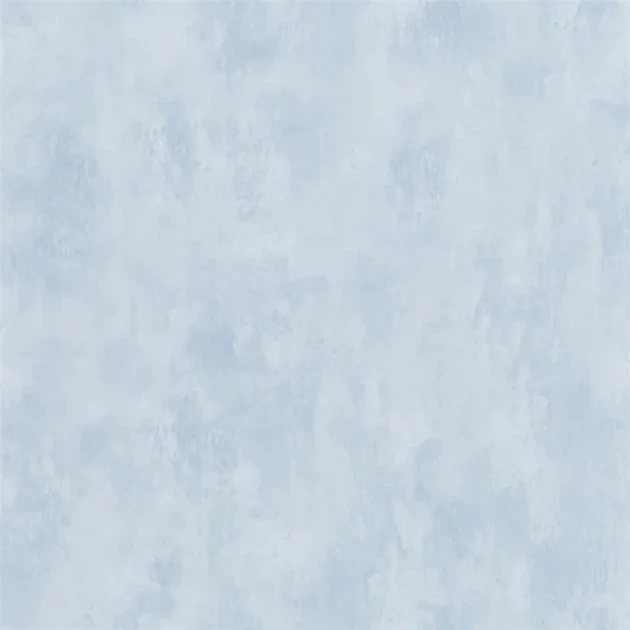 Designers Guild PDG719/20 Parchment Cloudless - tapeta z motywem ściany z betonu